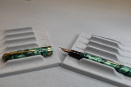 A Conway Stewart 85L leverfill fountain pen in green marble with single band to cap having a