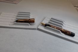 A Parker Valentine/ Victory button fill fountain pen in brown hatch with no bands to cap and