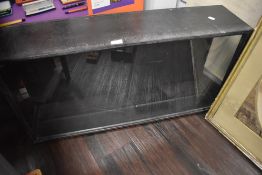 A wooden sided and glass fronted display case
