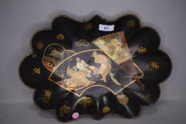 An Edo period japanese lacquer scalloped bowl decorated with scene of Samurai presenting a severed