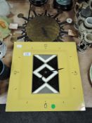 Two vintage clocks having minimalist styling.