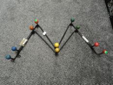 Two mid century atomic style coat racks.