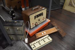 A selection of scientific test equipment including Panax, a microscope and multimeter