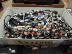 A box full of modern costume jewellery.
