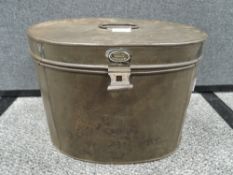 A Victorian hat tin having badge for Hartley Maker Ulverstone.