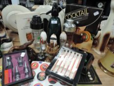 A mixed lot of breweriana including ash trays and cocktail related books,shakers and more.