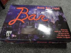 A neon 'Bar' light.