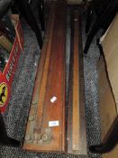 Two wooden scientific measuring tools.