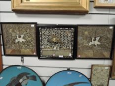 A set of three Chinese silk panels showing phoenix over ocean and night sky, central panel of