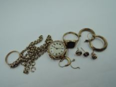 A small selection of yellow metal and 9ct gold broken jewellery including chain, watch face, dress