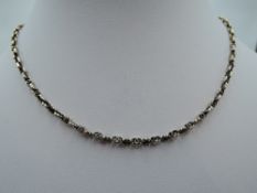 A yellow metal fancy link chain, approx 18' & 5.7g
