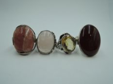 Four HM silver and white metal rings stamped silver, all of Artisan style having non precious/