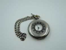 An HM silver half hunter top wound pocket watch by Pinnacle having Roman numeral dial with