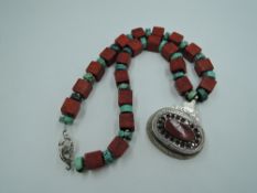 An Artisan necklace by Esola of Australia stamped 925, having turquoise and red cubic bead