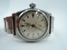 A vintage Rolex Oyster manual wind wrist watch having baton numeral dial with subsidiary seconds, in
