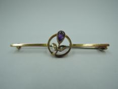 A yellow metal bar brooch stamped 9ct having amethyst and seed pearl decoration, approx 1.8g