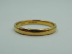 A 22ct gold wedding band, size R & 3.8g