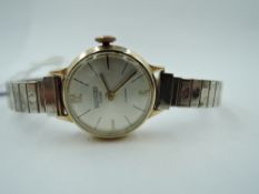 A lady's 9ct gold wrist watch by Thermidor having baton & Arabic numeral dial to circular face on