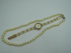 A cultured pearl necklace of even knotted form having a silver clasp, approx 18' and a fashion dress