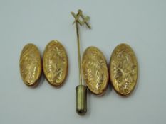 A pair of 9ct gold cufflinks having oval panels and chain connectors with engraved foliate