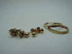 Three pairs of 9ct gold earrings including hoop, ball and knot stud, approx 2.7g