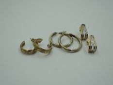 Three pairs of yellow metal and 9ct gold earrings of various designs, approx 3.2g