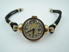 A lady's vintage 9ct gold Rolex wrist watch having Arabic numeral dial with subsidiary seconds to