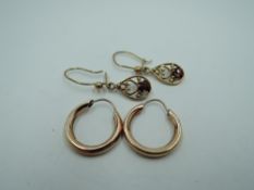 Two pairs of 9ct gold earrings including hoop and decorative drop loop, approx 2.2g