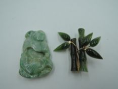 A carved jadeite style pendant and a jade style brooch modelled as bamboo