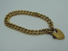 A yellow metal hollow link curb chain bracelet, links stamped 9C, having a 9ct gold padlock clasp,