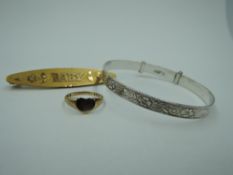 Three pieces of baby's jewellery including silver christening bangle, tiny yellow metal heart shaped