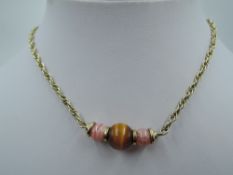 A 9ct gold rope chain necklace with central three bead panel, approx 15' & 13.4g