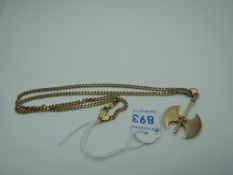 A yellow metal pendant in the form of a double blade axe stamped 585 on a yellow metal chain stamped