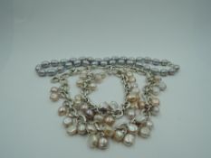 An HM silver modern heavy link necklace and matching bracelet having pastel coloured baroque pearl