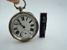 A Continental silver key wound pocket watch having oversized Roman numeral dial with subsidiary