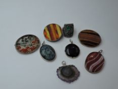 A selection of white metal and mineral jewellery including moss agate brooch, quartz pendant,