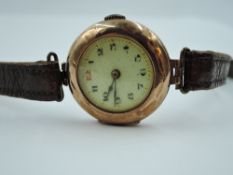 A vintage 9ct rose gold wrist watch having Arabic numeral dial with gilt minute dots in gold case