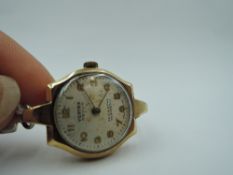A lady's vintage 9ct gold wrist watch by Vertex having Arabic numeral dial in gold case with later