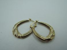 A pair of 9ct gold hoop earrings having moulded decoration, approx 1.2g