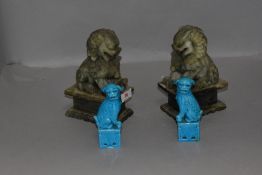 Two pairs of Chinese temple dogs of Fo one hand carved soap stone and similar blue glaze porcelain