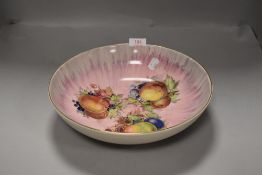 A large fruit bowl having print of plums peaches and apples by Clarice Cliff Royal Staffordshire