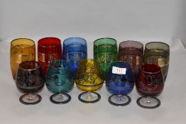 Two sets of harlequin glass one set Venetian with silver decoration and similar water glasses