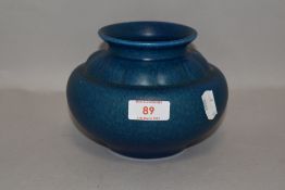 An arts and crafts style squat vase by Royal Lancastrian pottery in a deep blue glaze