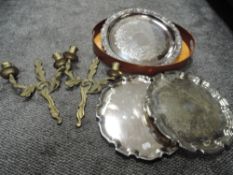 Three plated salvers, one having relief grapevine design to edges, also a brass wall sconce and