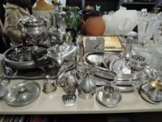 A large collection of mixed flat ware including tea pot, tray. Cutlery and much more.