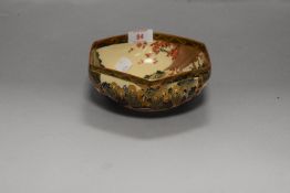 A Japanese Satsuma decorated bowl hand painted with scenes of busy markets