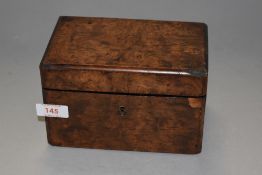An early Victorian tea caddy having maple or similar burr wood front and mahogany case