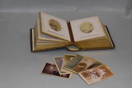 A Victorian photograph album containing a number of ghost or spirit photographs