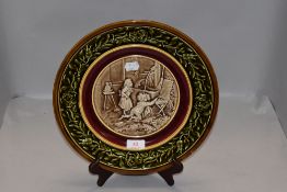 A vintage ceramic plate by Schutz Blansko Austria depicting children playing