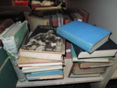 An assortment of books amongst which are Les Miserables and and out with Romany again.